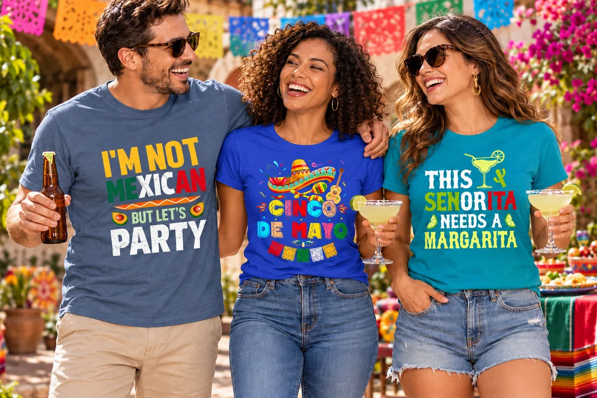 Three adults wearing Cinco De Mayo shirts with colorful party, fiesta, and margarita designs at a courtyard celebration.