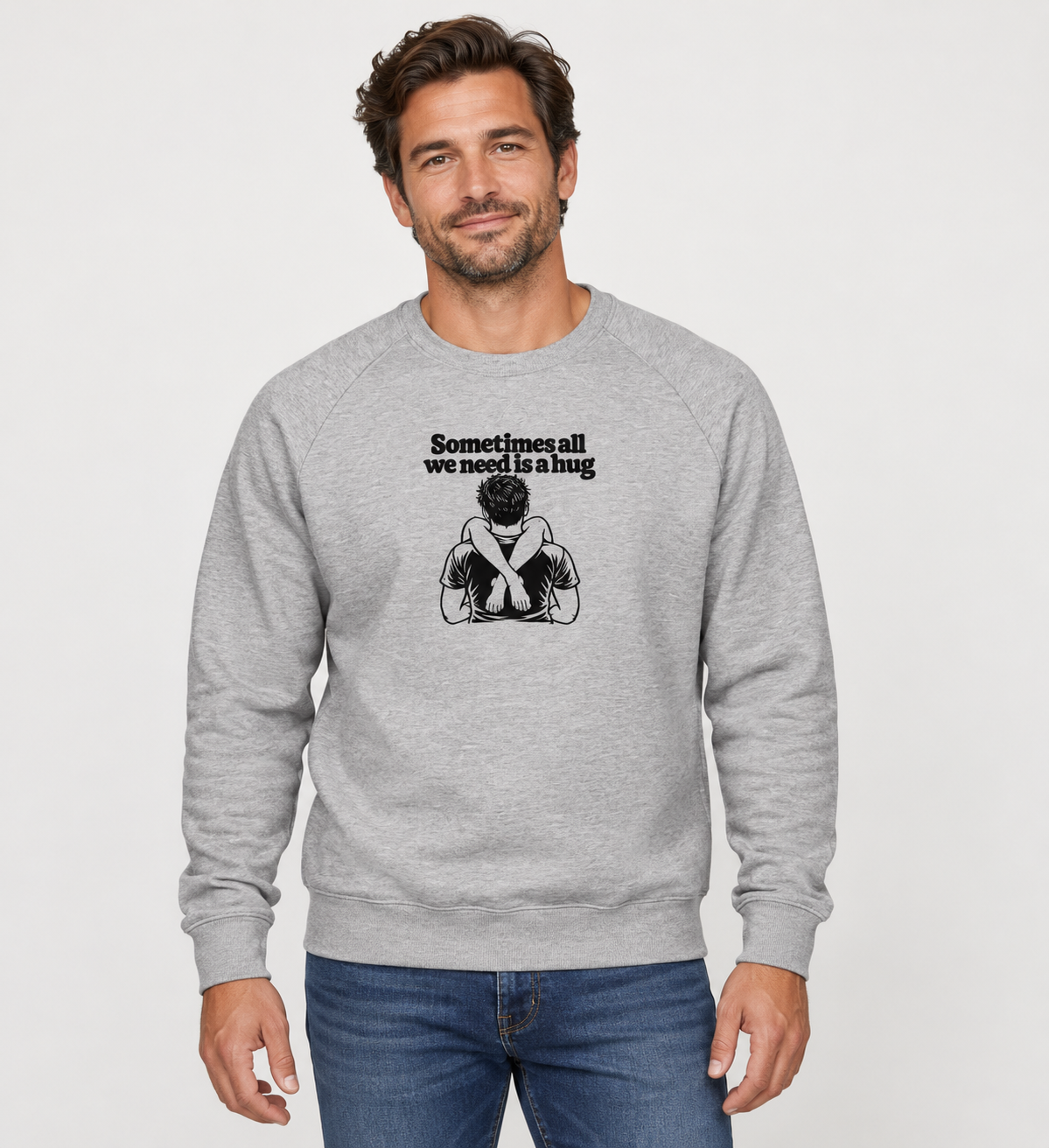 Male model wearing the grey Sometimes All We Need Is a Hug premium sweatshirt with black artwork on the chest.